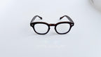 Rame ochelari Moscot Style cu design clasic și lentile transparente, în nuanțe de maro tortoise.