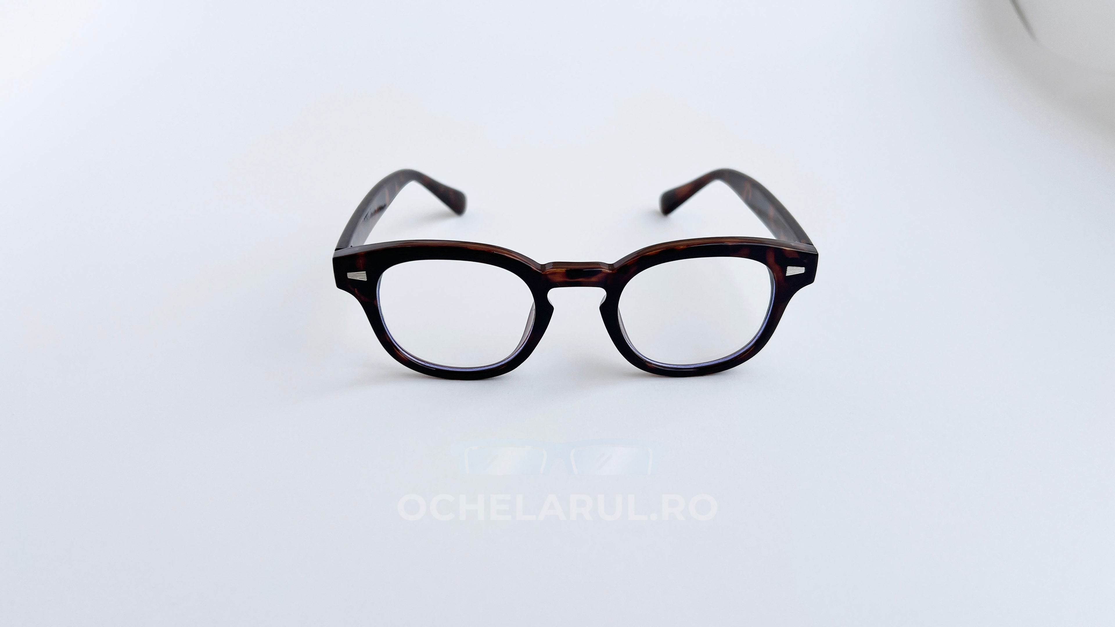 Rame ochelari Moscot Style cu design clasic și lentile transparente, în nuanțe de maro tortoise.