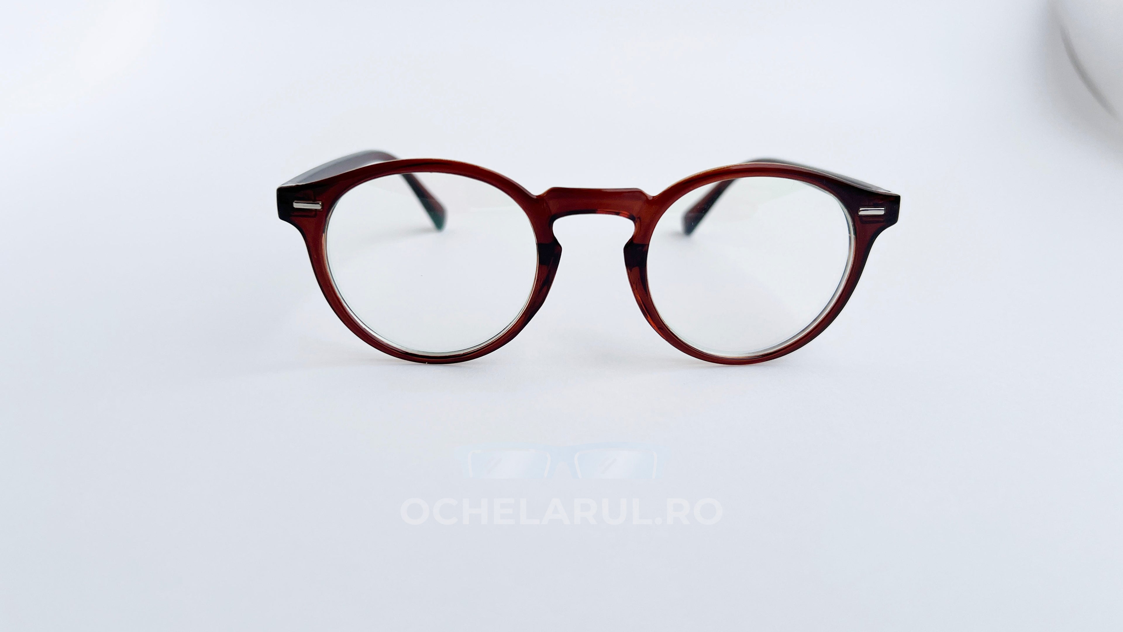 Rame ochelari Oliver Peoples Style maro degrade cu lentile transparente, design elegant și modern.
