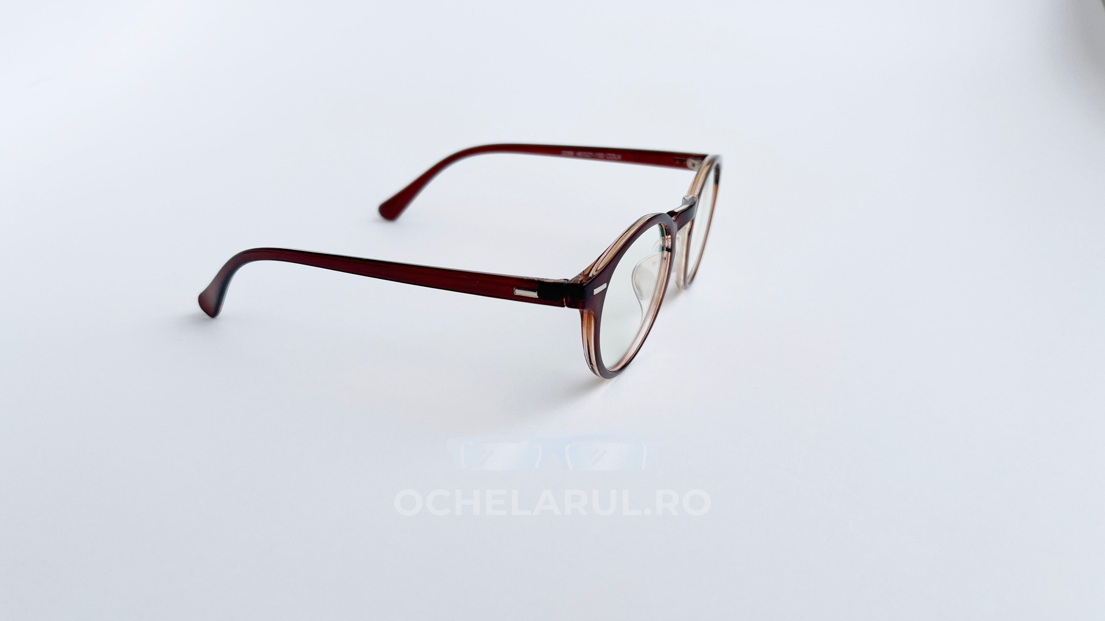 Rame ochelari Oliver Peoples Style maro degrade cu lentile transparente, design elegant și modern.