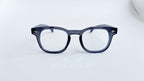 Rame ochelari Pătrate Moscot Style cu lentile transparente și ramă albastru închis, design clasic și elegant.