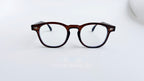 Rame ochelari Pătrate Moscot Style maro transparent, cu lentile clare, design elegant pentru un aspect clasic.