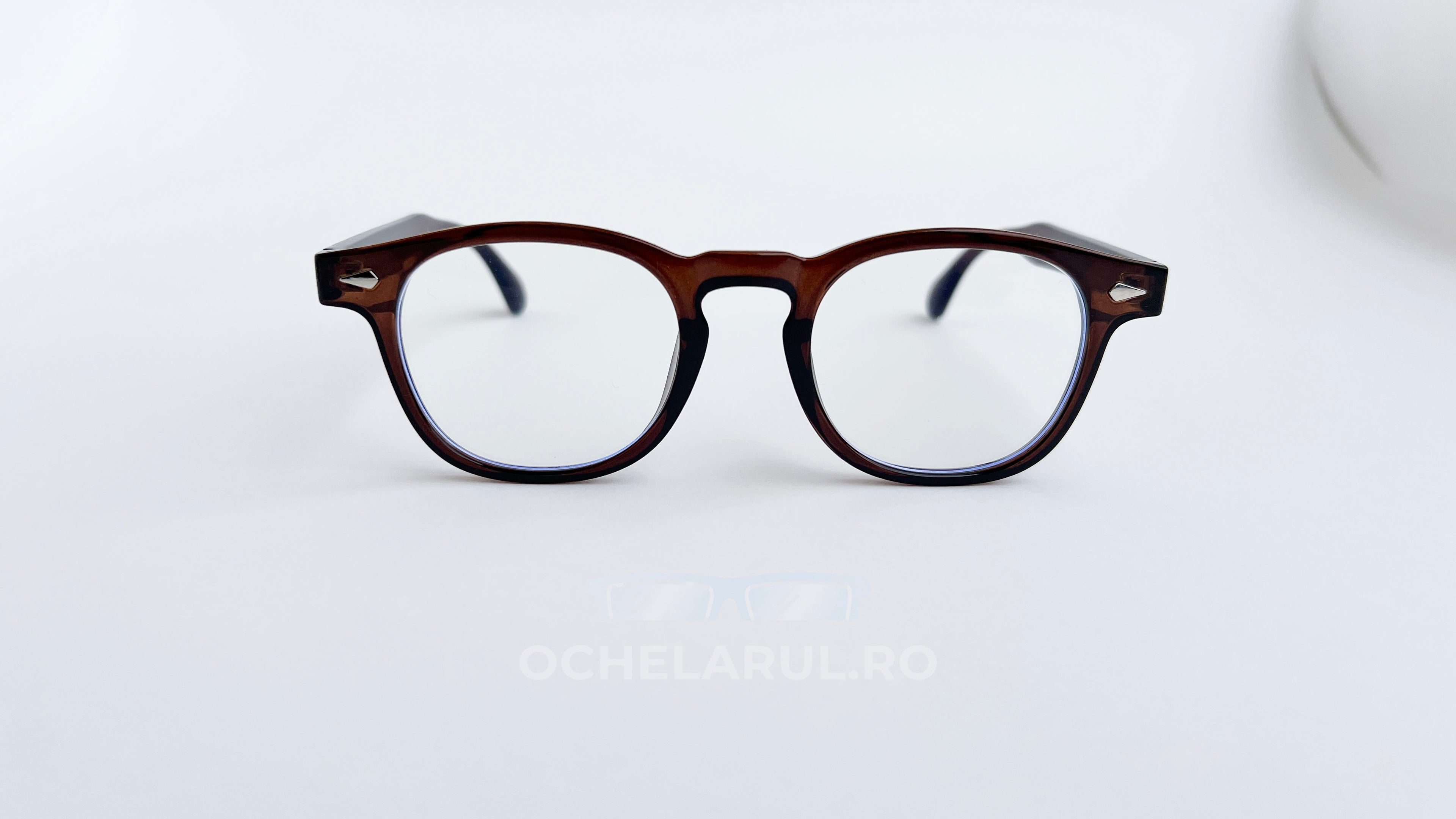 Rame ochelari Pătrate Moscot Style maro transparent, cu lentile clare, design elegant pentru un aspect clasic.