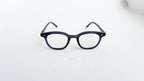 Rame ochelari Ovale Vintage de culoare gri închis, cu lentile transparente și design clasic pentru ochelari de vedere.