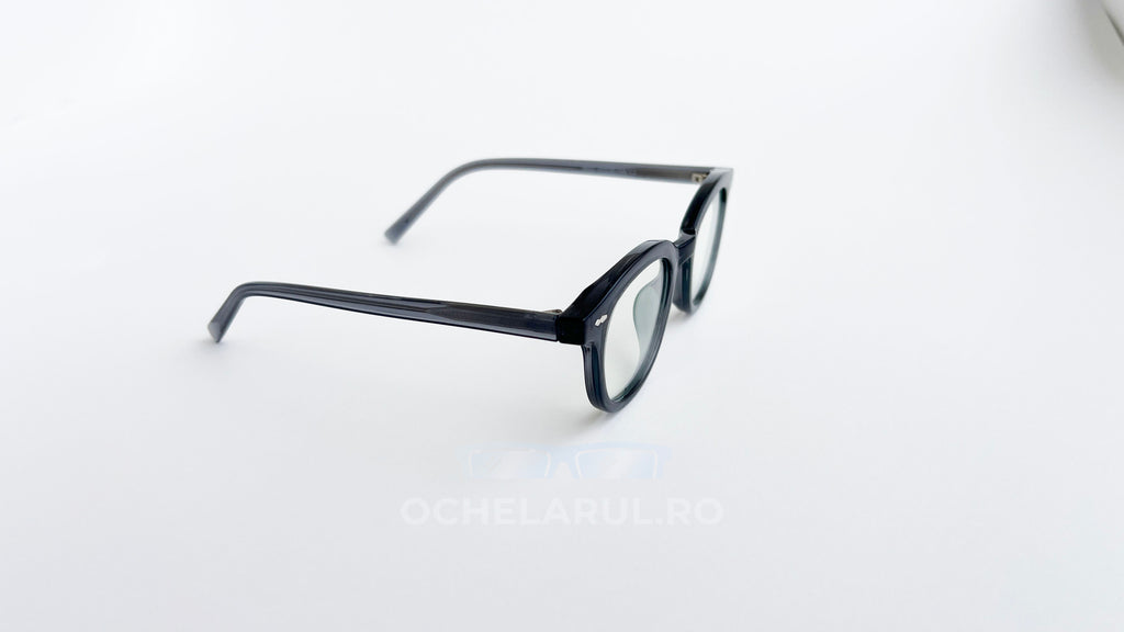 Rame ochelari Ovale Vintage cu lentile transparente și design clasic, din material gri închis.