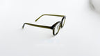 Rame ochelari Ovale Vintage cu lentile transparente și design verde închis, stil retro elegant.