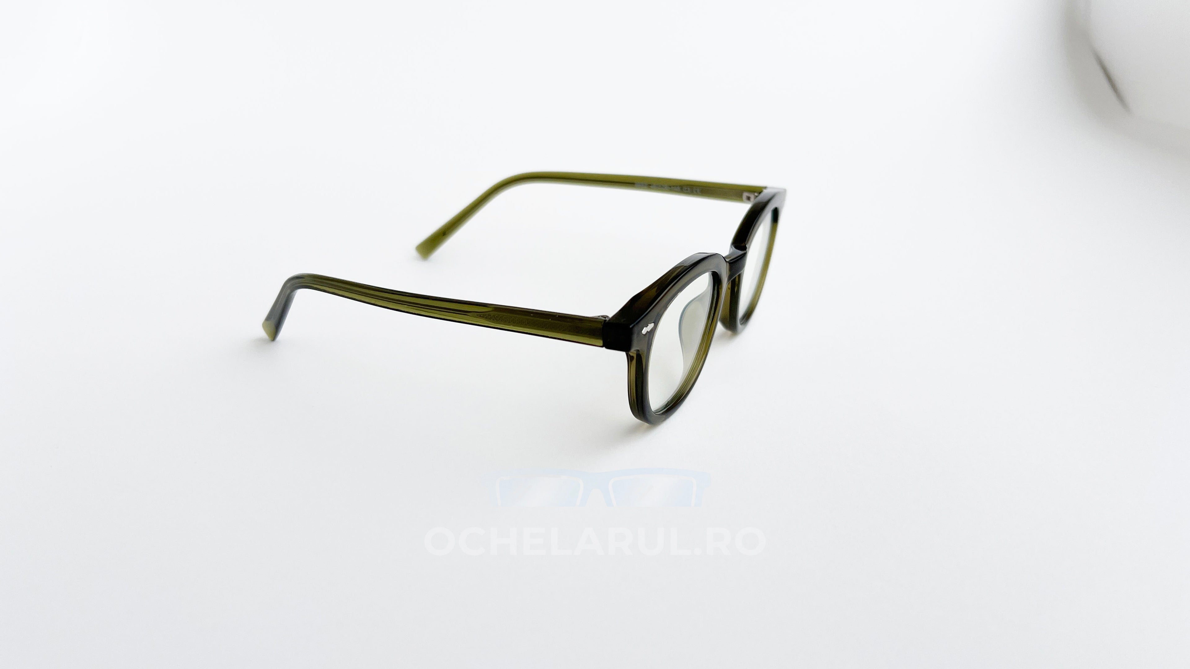 Rame ochelari Ovale Vintage cu lentile transparente și design verde închis, stil retro elegant.