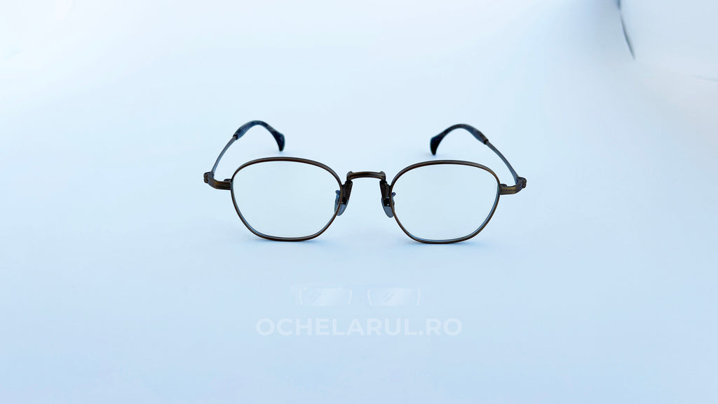Rame ochelari Pătrați din Titan Vintage Style cu design bronz elegant și lentile transparente, ideale pentru un look rafinat și clasic oferit de ochelarul.ro.