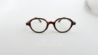 Rame ochelari Retro Style cu lentile transparente și cadru de culoare havana, design vintage unisex.