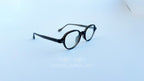 Rame ochelari Retro Style negre, design clasic rotund, cu lentile transparente, eleganță și confort.
