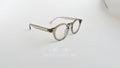 Rame Ochelari Rotunde Groase, culoare bej transparent, design retro cu lentile transparente, stil modern și elegant.