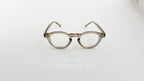 Rame Ochelari Rotunde Groase, transparente cu tentă bej, cu lentile clare, design retro minimalist.