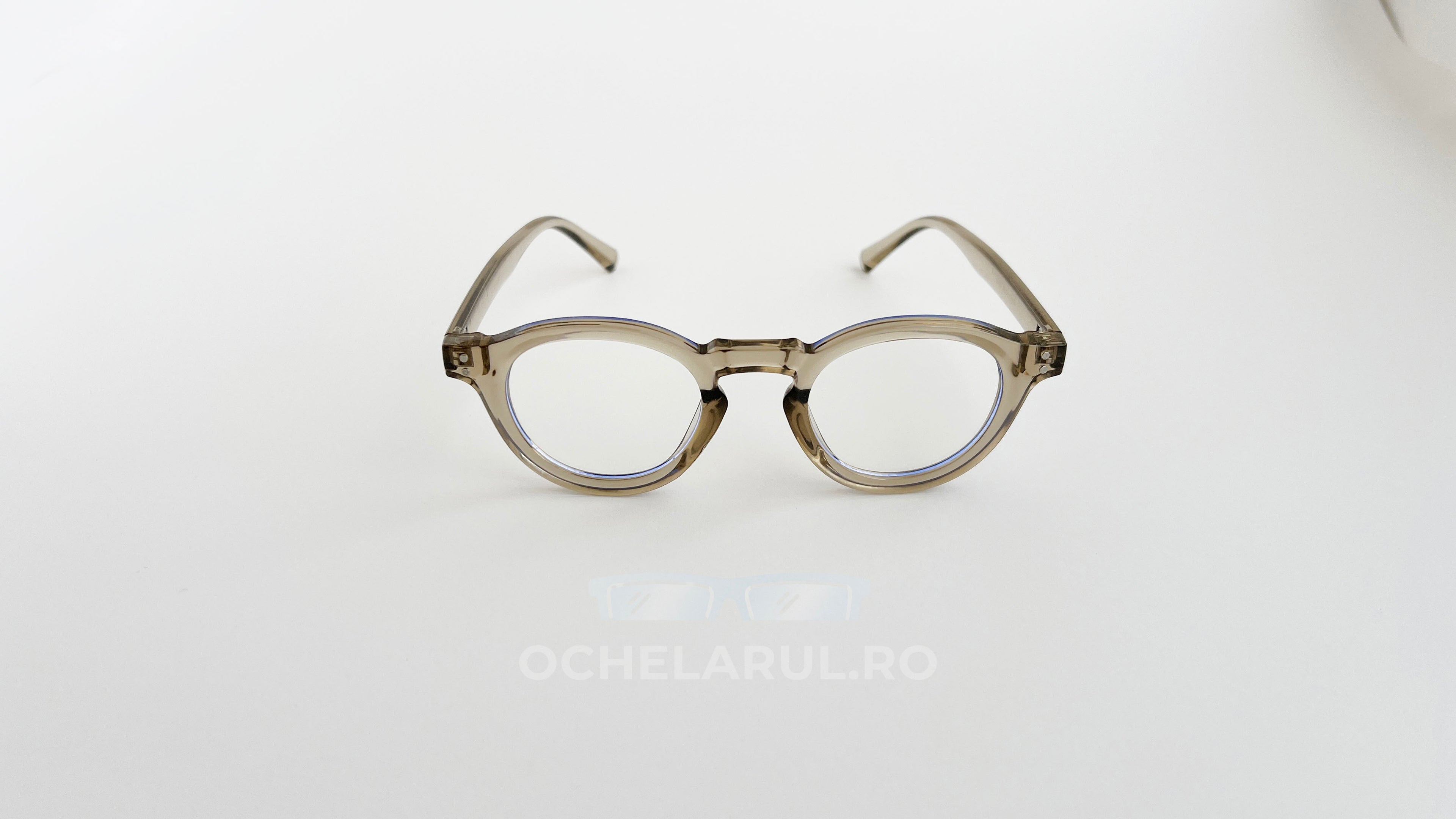 Rame Ochelari Rotunde Groase, transparente cu tentă bej, cu lentile clare, design retro minimalist.