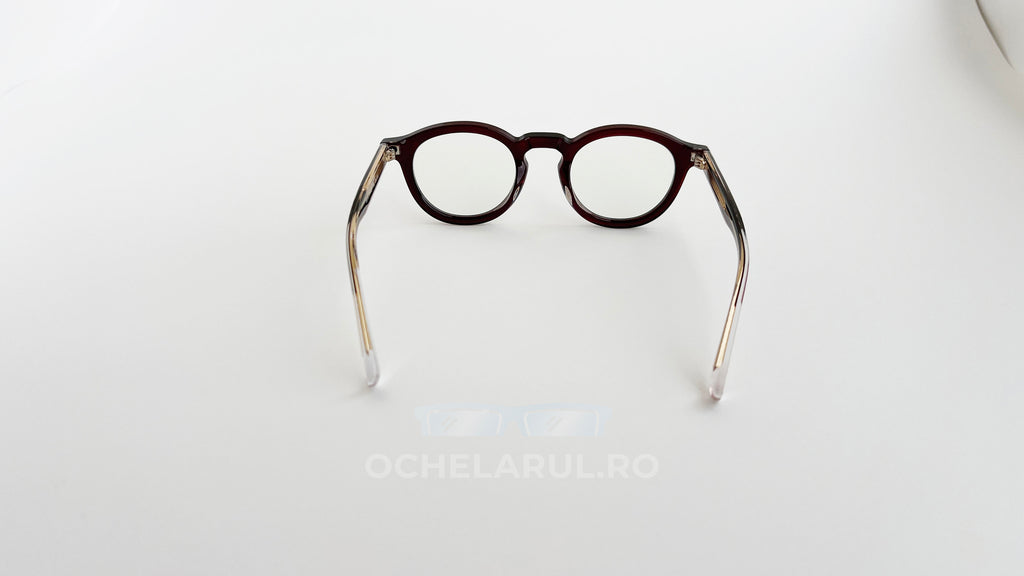 Rame Ochelari Rotunde Groase cu lentile transparente și cadru gros, de culoare visinie, design retro simplu și elegant.